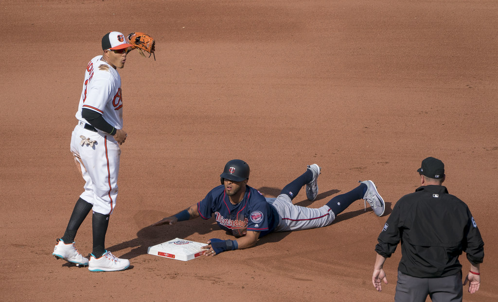 The Twins Eddie Rosario stealing second while Manny Machado tries to tag him out.