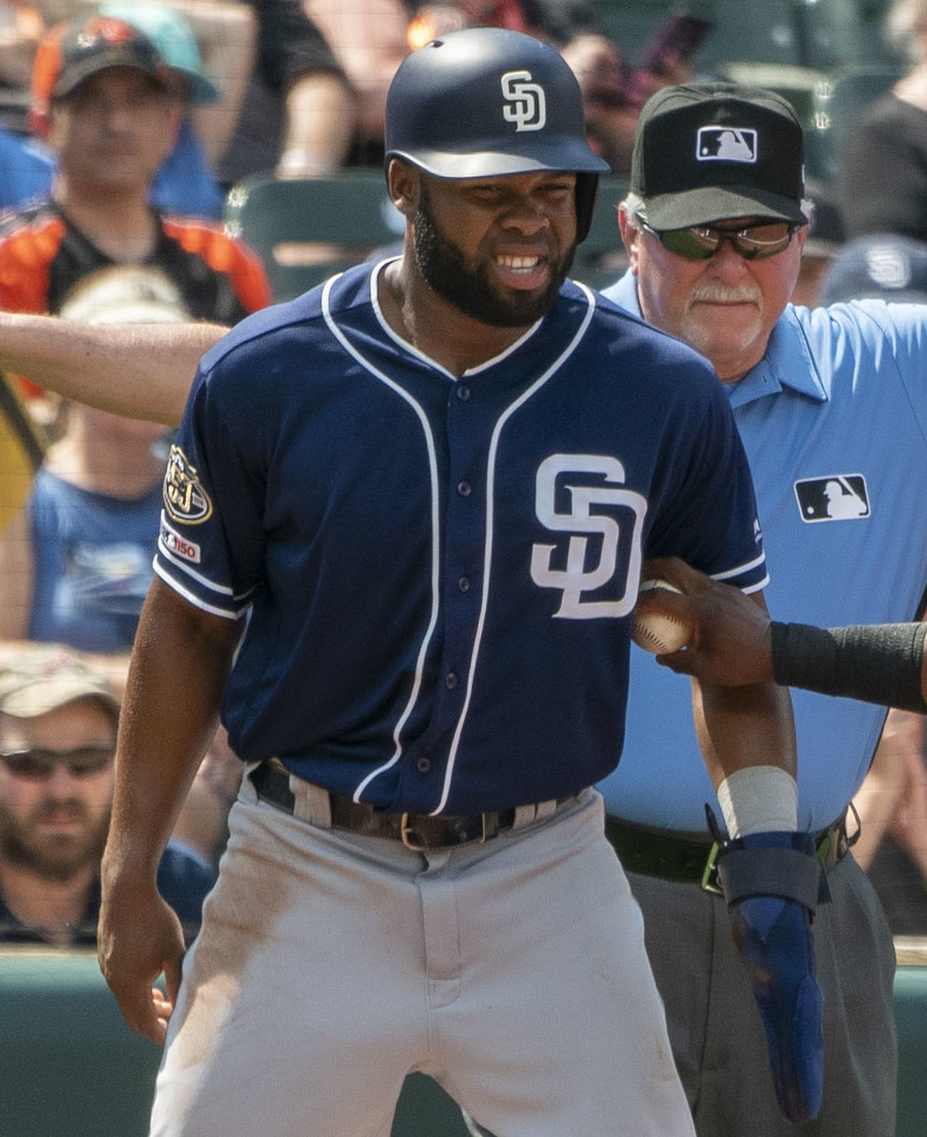 The Padres Manuel Margot glares into the middle of the infield after reaching first base